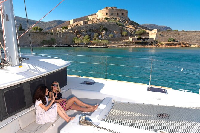 Ag. Nikolaos Catamaran to Spinalonga - Gourmet Meal & Water Toys - The Artemis-style catamaran comfort: shade, sunbeds, and onboard basics