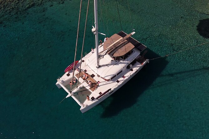 Catamaran Cruise to Dia Island with Meal and Water Activities - Water activities: SUP, snorkeling gear, and fishing time