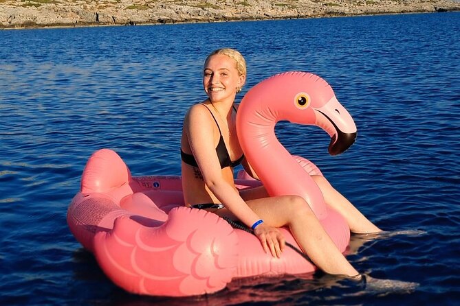 Panormo: Luxury Sunset Catamaran Cruise Sushi & Open Bar - At anchor: SUP, snorkeling gear, and the inflatable flamingo moment