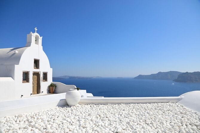 Santorini Full-Day Tour from Heraklion Crete - Firostefani’s blue dome and bells: quick, iconic, efficient