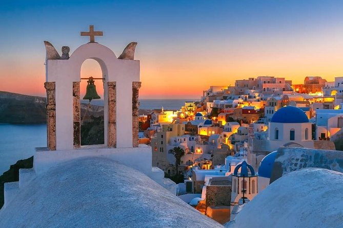 Santorini Island: Guided Tour From Heraklion Crete - Oia’s main street: the caldera edge at full photo speed