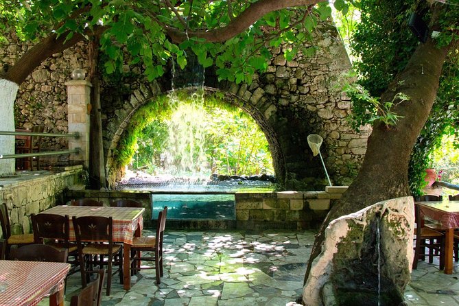 Winery Tour and Kourna's Lake from Rethymno - The winery visit: courtyard calm, botanical gardens, and working production areas
